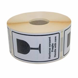 Advarselsetiketter Handle With Care Hvid selvklæbende etiket med sort symbol og tekst: Handle with care. Format 120x70mm, 1000 etiketter pr. rulle.